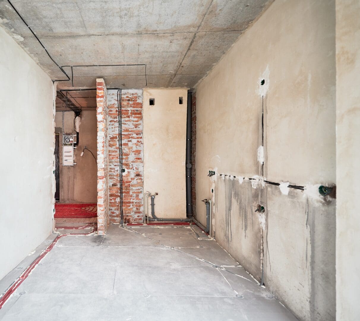 Photo collage of old apartment and new renovated room with parquet floor, kitchen counter, stove and white kitchen furniture. Concept of home renovation, restoration and refurbishment.